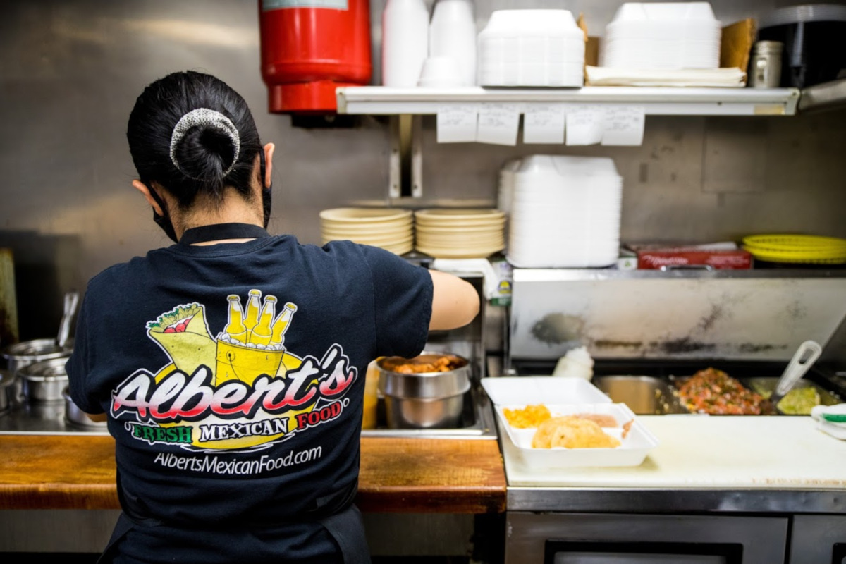 Staff member preparing food